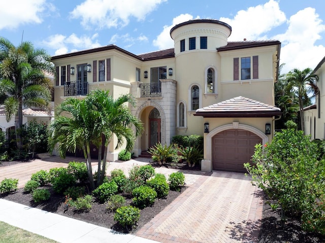 mediterranean / spanish-style home with a balcony