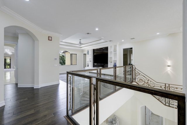 corridor with crown molding and dark wood-type flooring