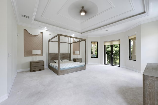 unfurnished bedroom featuring a raised ceiling, french doors, light colored carpet, and ornamental molding