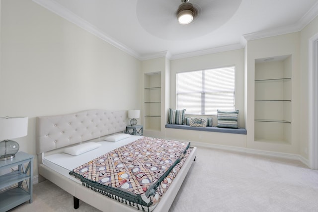 carpeted bedroom featuring ceiling fan and crown molding