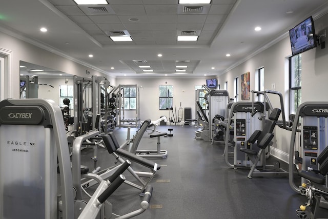 gym with a paneled ceiling and crown molding