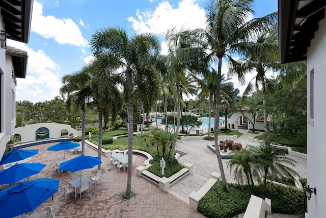 view of community featuring a pool and a patio