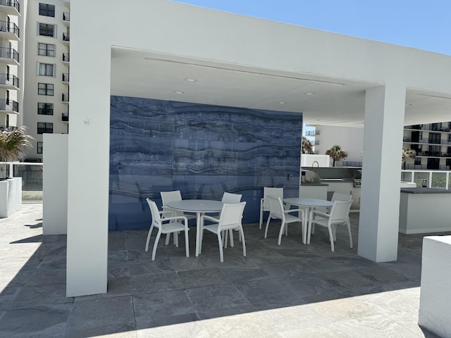 view of patio featuring outdoor dining area