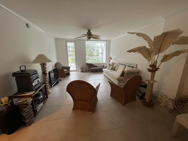 tiled living room featuring crown molding and ceiling fan