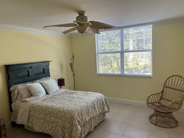 bedroom with light tile patterned flooring, crown molding, baseboards, and ceiling fan