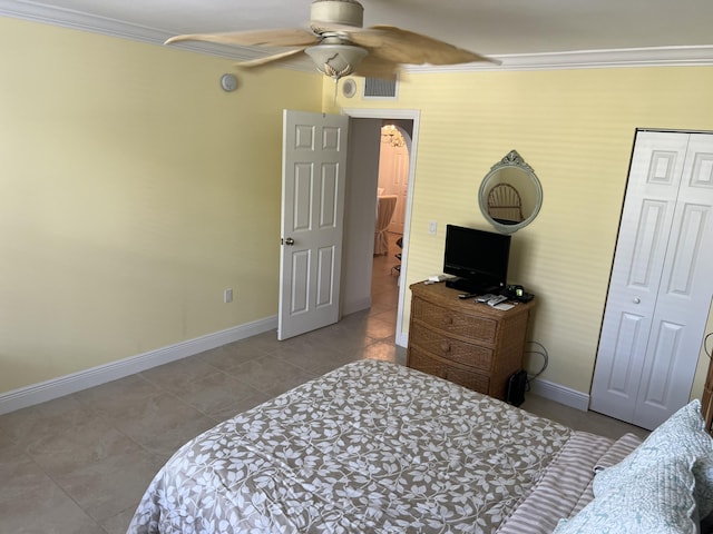 bedroom featuring baseboards, visible vents, and ornamental molding