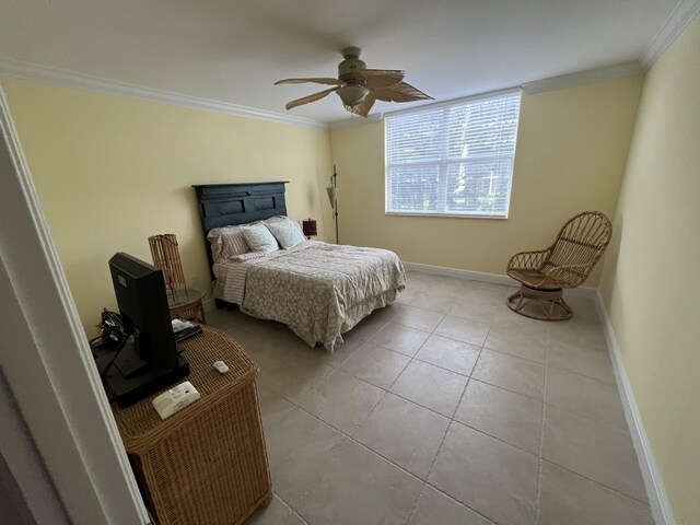 bedroom with crown molding, ceiling fan, and light tile patterned floors