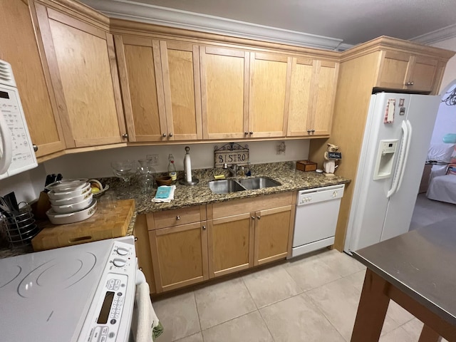 kitchen featuring dark stone counters, ornamental molding, white appliances, light tile patterned floors, and sink