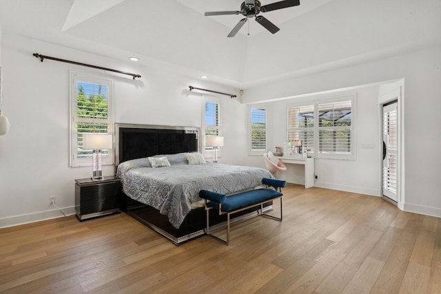 bedroom featuring vaulted ceiling and light wood-type flooring