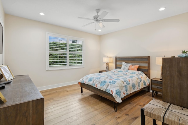 bedroom featuring light hardwood / wood-style flooring and ceiling fan