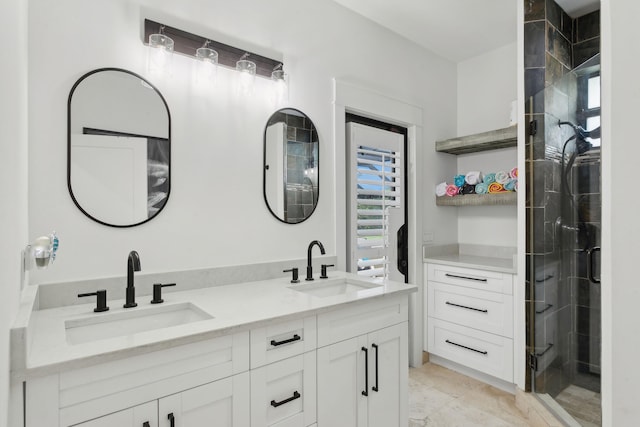 bathroom with vanity and a shower with shower door