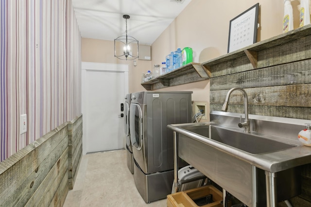 washroom featuring washer and dryer and sink