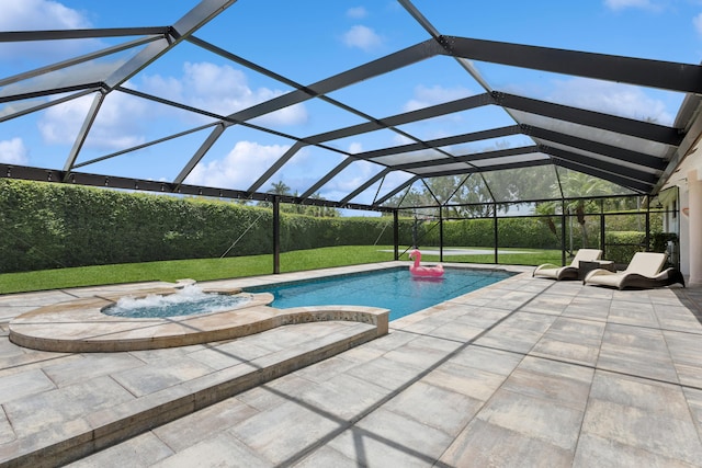 view of pool with an in ground hot tub, a lanai, a lawn, and a patio area