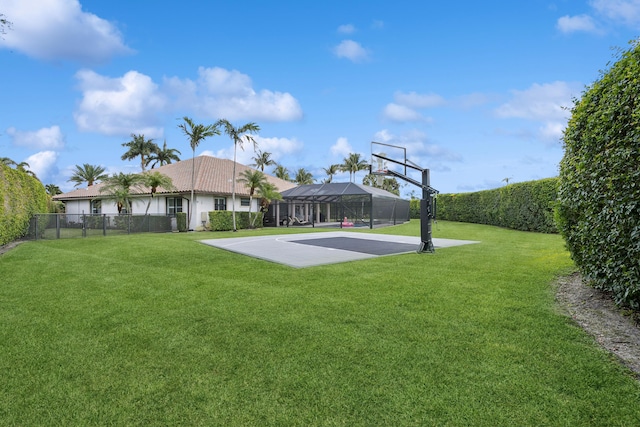 view of basketball court with a lawn