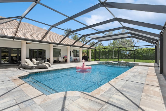 view of swimming pool with an outdoor living space, a lanai, a patio area, and ceiling fan