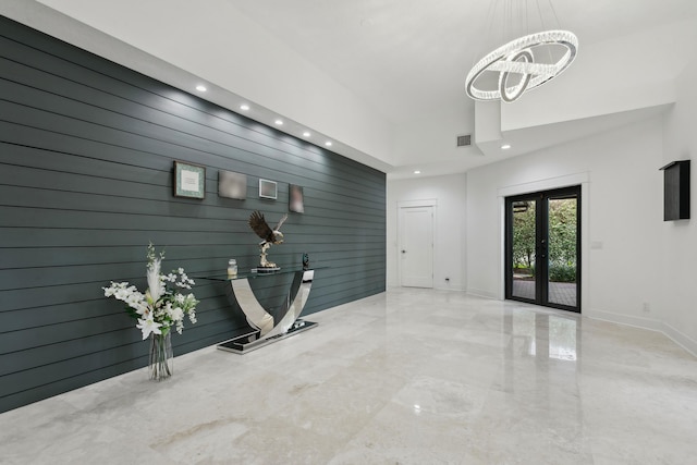 interior space featuring an inviting chandelier and french doors