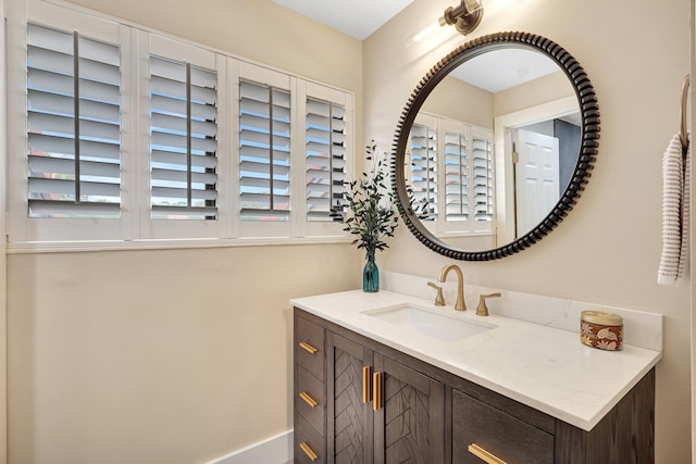 bathroom featuring vanity and plenty of natural light