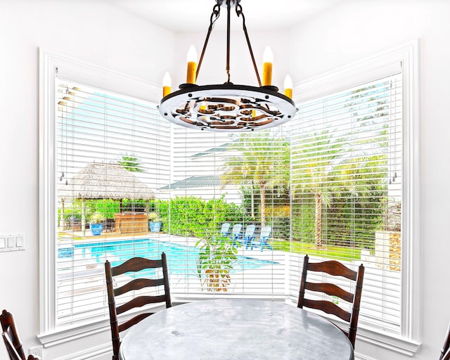 dining space with a chandelier