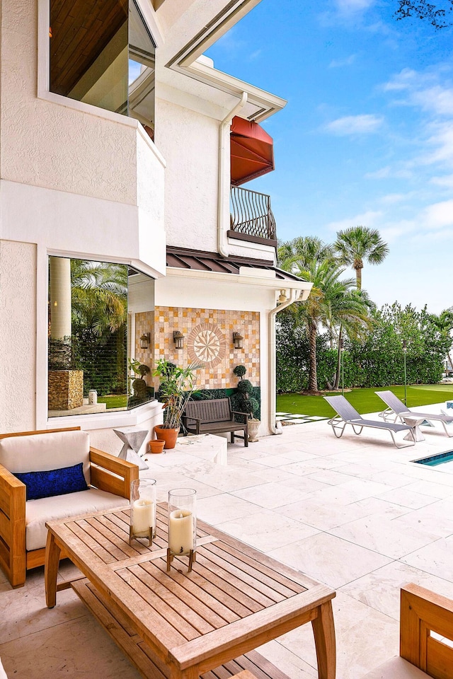 view of patio / terrace with outdoor lounge area and a balcony