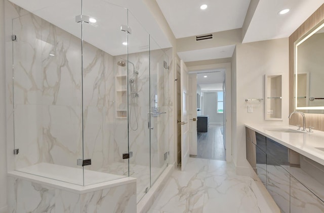 bathroom with vanity and a shower with shower door