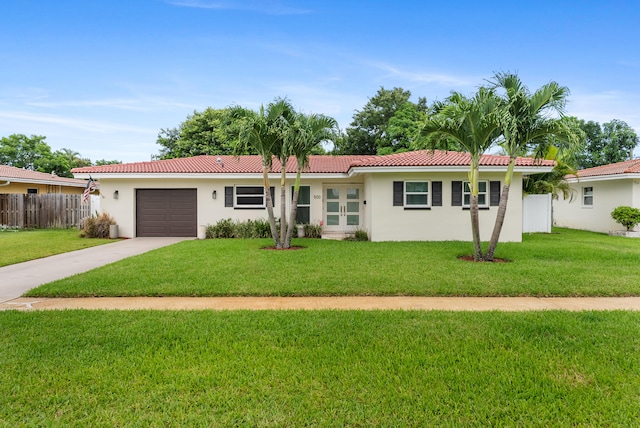 single story home with a front yard and a garage