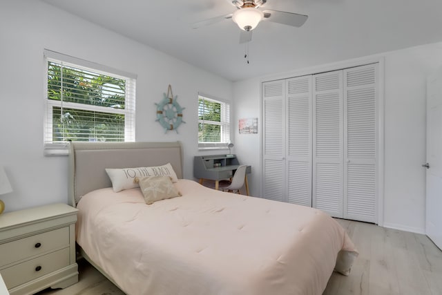 bedroom featuring a closet, ceiling fan, and light hardwood / wood-style floors