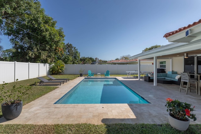 view of pool featuring a patio and an outdoor living space