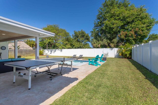 view of yard with a patio area and a fenced in pool