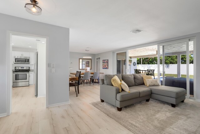 living room with light hardwood / wood-style floors