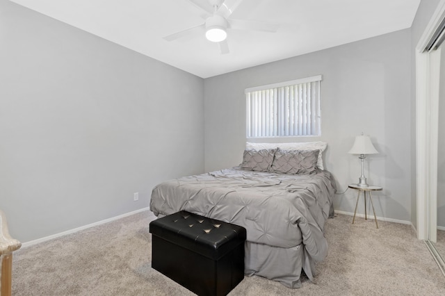 bedroom with ceiling fan and light carpet