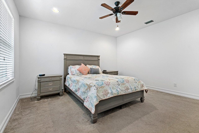 carpeted bedroom with ceiling fan