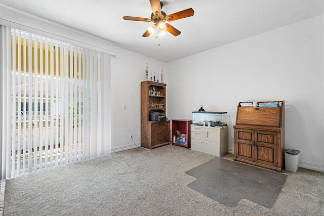 misc room with ceiling fan and light carpet