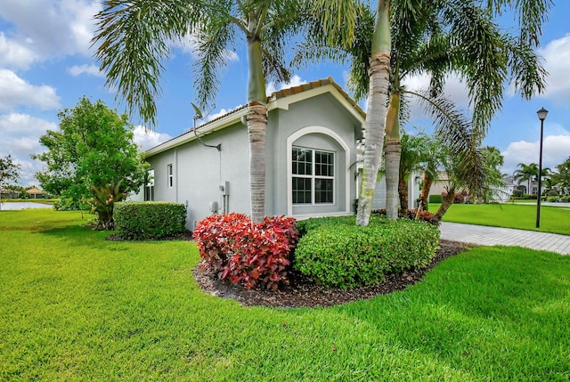 view of home's exterior featuring a lawn