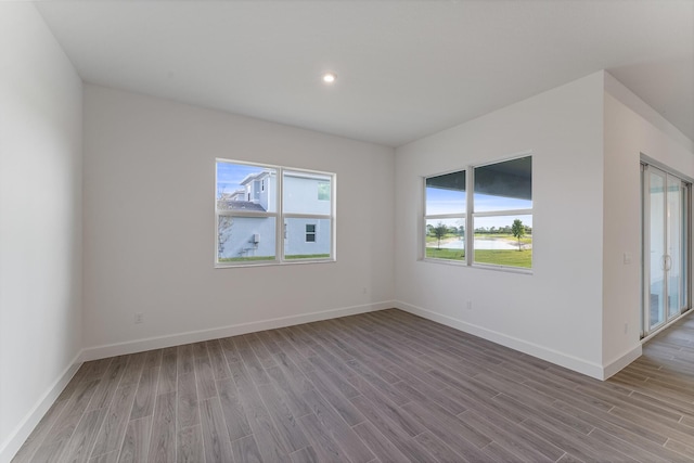 spare room with light hardwood / wood-style floors