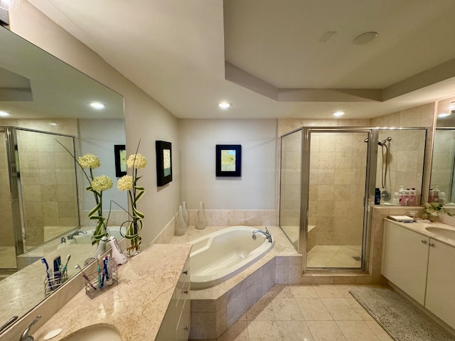 bathroom with shower with separate bathtub, tile flooring, double sink, and vanity with extensive cabinet space