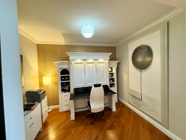 office with hardwood / wood-style flooring, a textured ceiling, and crown molding