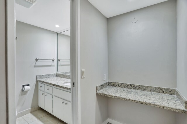 full bathroom with tile patterned flooring, vanity, toilet, and tiled shower / bath