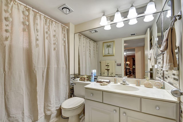 bathroom with toilet and vanity