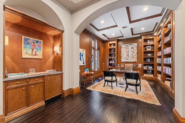 dining room featuring beam ceiling, coffered ceiling, dark hardwood / wood-style floors, and built in features