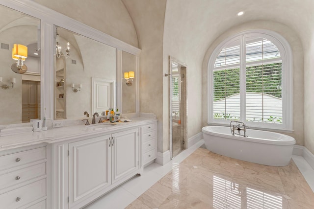 bathroom featuring tile floors, large vanity, vaulted ceiling, and separate shower and tub