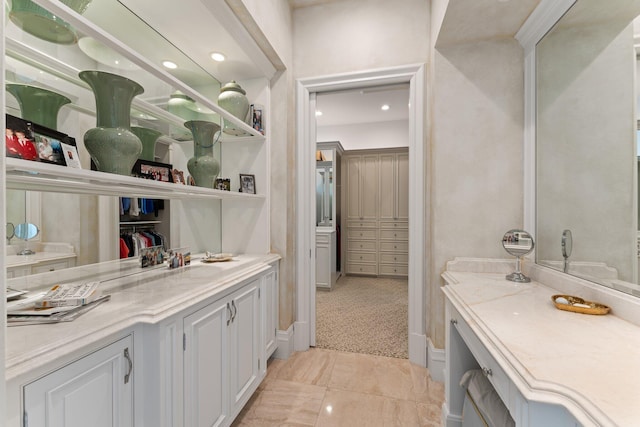 bathroom featuring tile floors and vanity