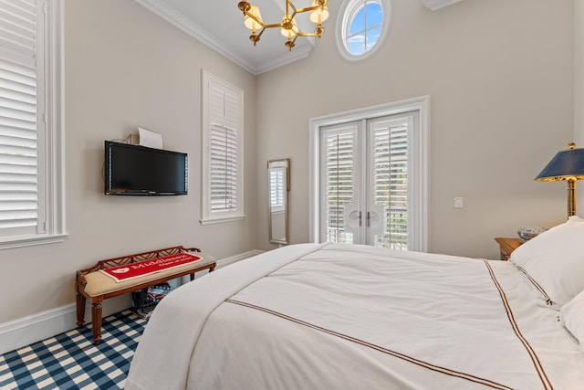 bedroom featuring a chandelier, french doors, carpet flooring, and crown molding