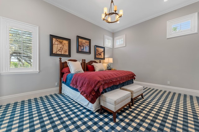 bedroom featuring ornamental molding and an inviting chandelier