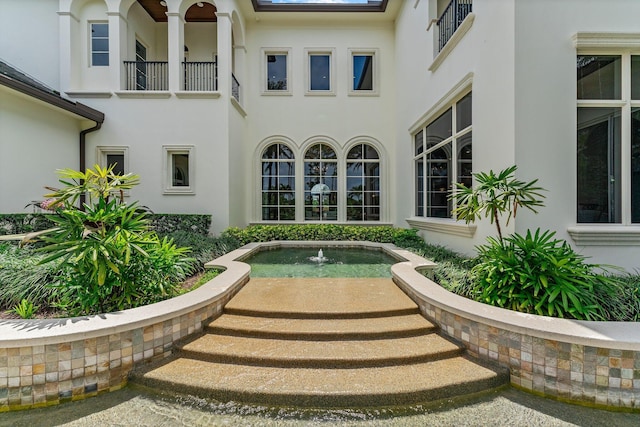 property entrance with a balcony