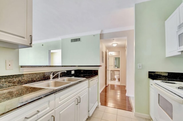 kitchen featuring ornamental molding, white appliances, sink, light hardwood / wood-style floors, and white cabinetry