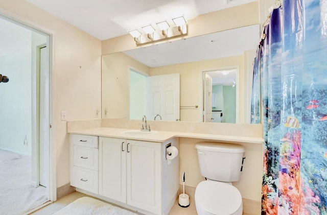 bathroom featuring vanity and toilet