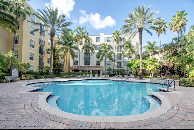 view of swimming pool with a patio