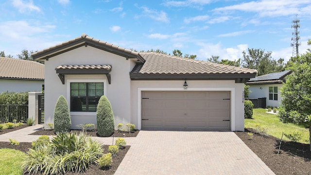 mediterranean / spanish-style house featuring a garage