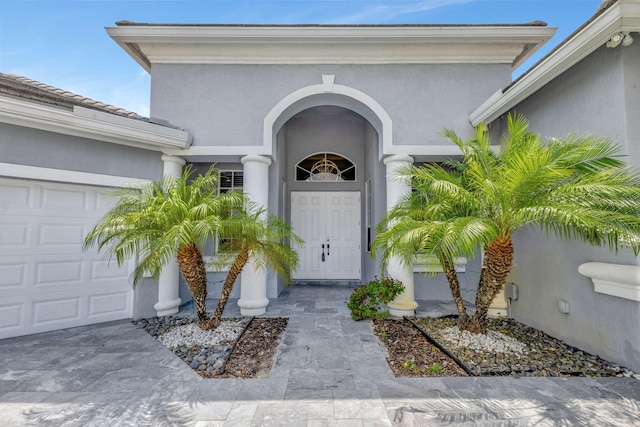 doorway to property featuring a garage