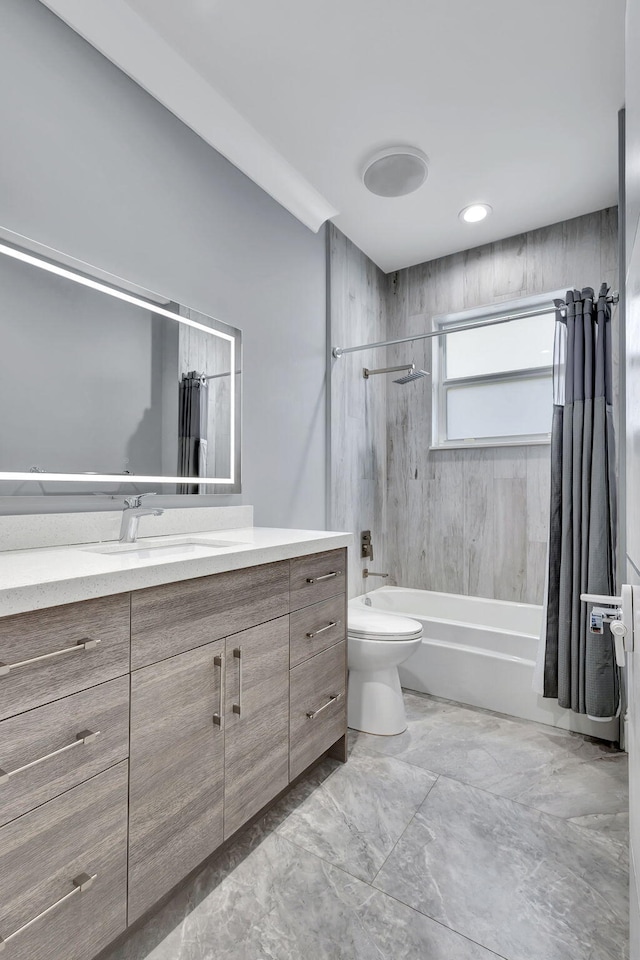 full bathroom featuring vanity, toilet, and shower / tub combo